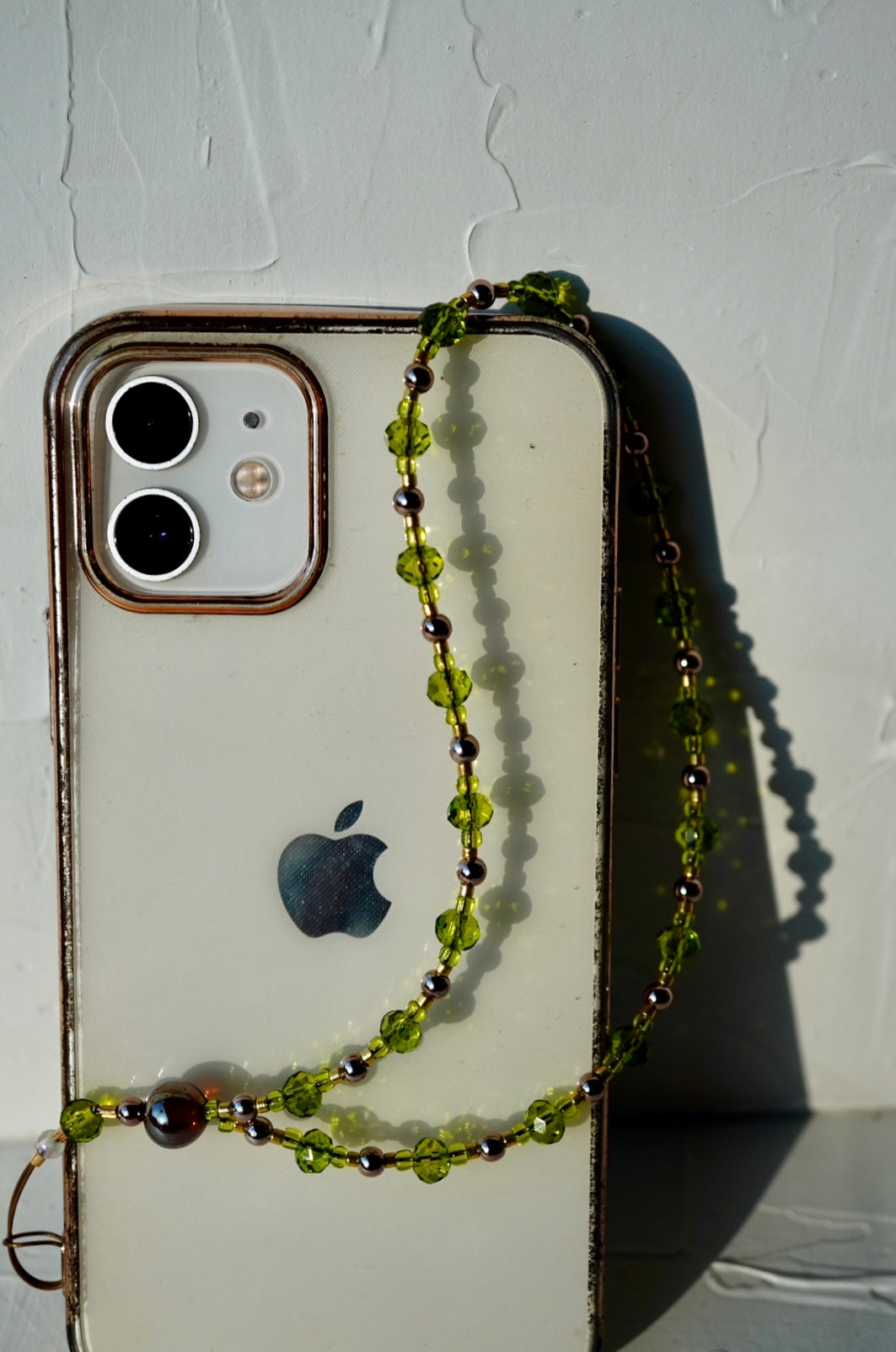 green and gold phone strap